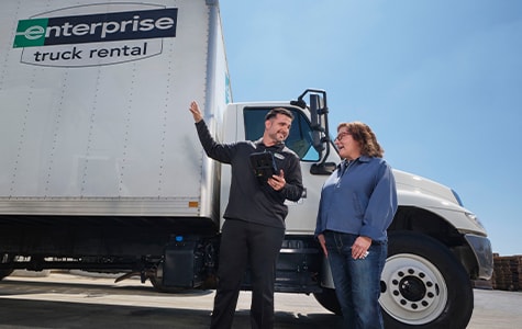 Two people discussing trucks